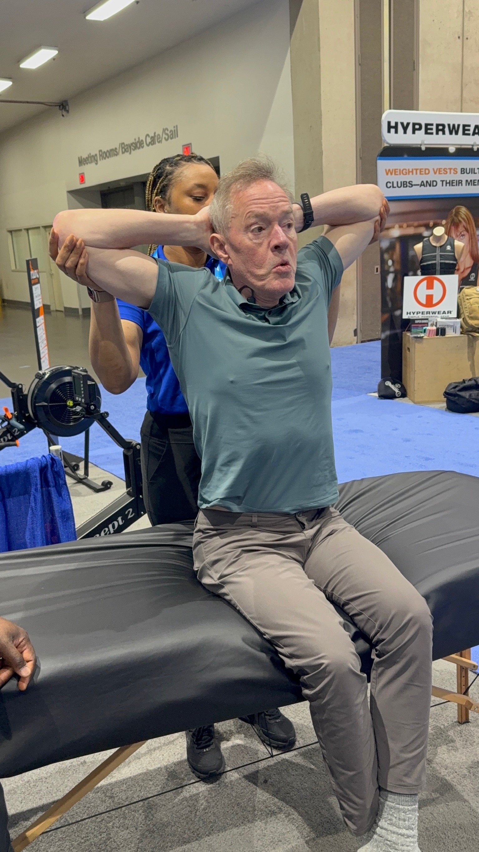 CNU Stretch — seated rotation stretch at HFA San Diego convention