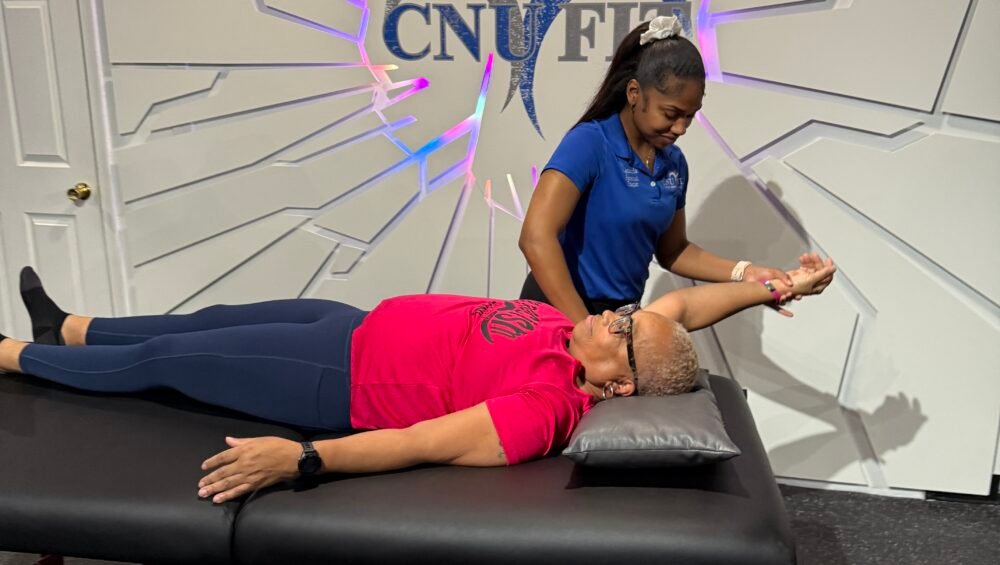 certified stretch therapist performing assisted stretch session