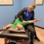 CNU Stretch certified stretch therapist performing assisted stretch session with client